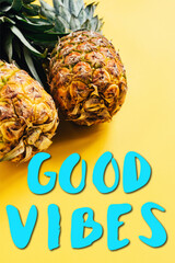 Wall Mural - fresh ripe pineapples on yellow background with good vibes illustration