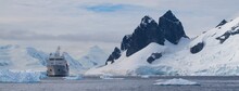 Ship Moored On Coastline In Antarctica