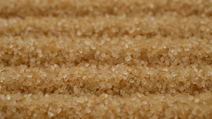 Wall Mural - brown sugar close up. Demerara golden brown sugar top view