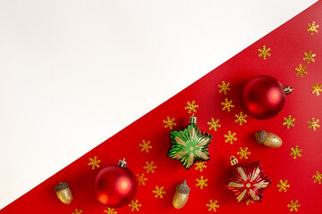 Wall Mural - Diagonally red and white background of Christmas decorations, colored toys.