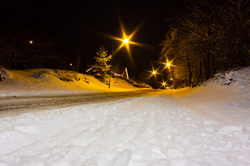Wall Mural - Snow covered roads at night
