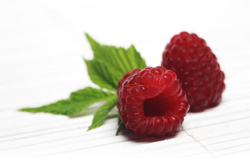 Wall Mural - Raspberries on white background - studio shot