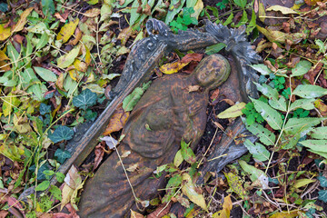 Historic Statue on the autumn mystery old Prague Cemetery, Czech Republic