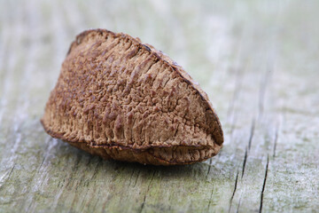 Wall Mural - Brazil nut on wooden background