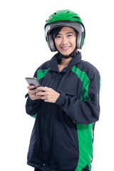 Wall Mural - asian beautiful delivery courier with helmet holding smartphone isolated over white background