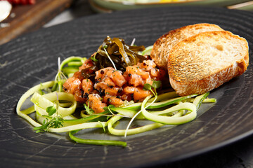 Wall Mural - Salmon tartare with cucumber and bread toast