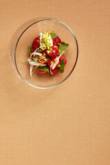 Canvas Print - Tomatoes with stracciatella in round transparent glass bowl