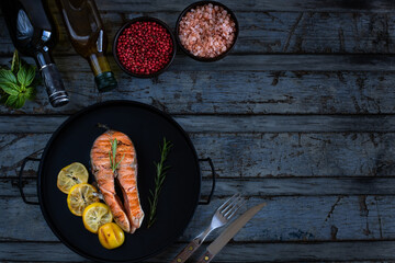 Wall Mural - Delicious grilled meal in the plate with dark background