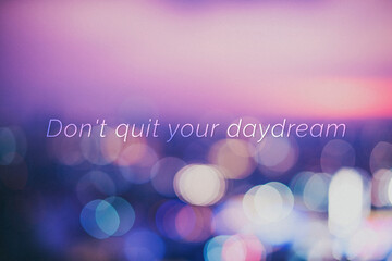 don't quit your daydream quote on a bokeh background