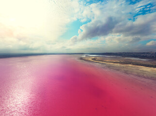 Fototapete - Landscape with Pink Lake and cloudy sky. Panoramic view from above at Pink Lake