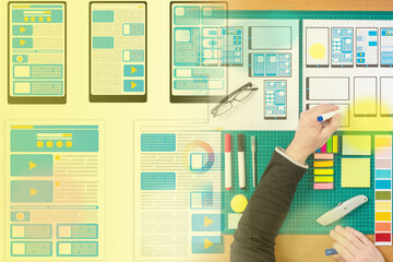 Wall Mural - application design. designer is developing usability of a mobile application. design engineer draws 