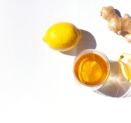 Glass of green tea with lemon and ginger close up