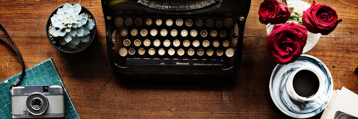 Wall Mural - retro typewriter on a wooden table website banner template