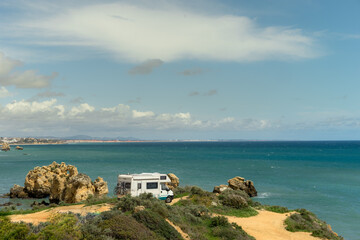 Camper van parked on a beach