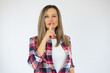 © Danko - Portrait of beautiful and young woman standing over isolated white background asking to be quiet with finger on lips. Silence and secret concept.