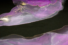 Pink Purple Smoky Pattern With Gold Pigment Alcohol Ink On Dark Black Background Close-up