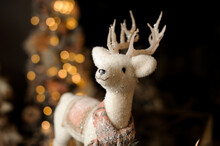 Close-up Of Beautiful Sparkling Christmas Toy In The Form Of White Deer With Antlers