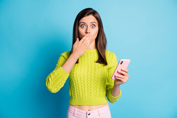 Sticker - Photo of young woman afraid scared worried panic fail mistake hand cover lips hold cellphone isolated over blue color background