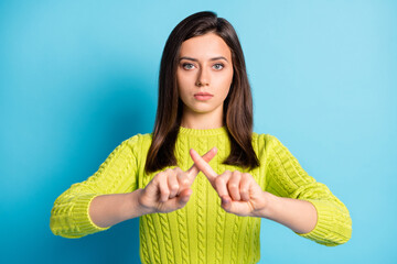 Wall Mural - portrait of young attractive serious calm girl woman female showing stop gesture with fingers isolat