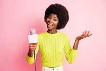 Full Size Photo Of Attractive Funny Person Hold Mic Wear Green Sweater Isolated On Pink Color Background