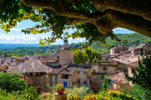 Travel Destination, Small Ancient Village Cotignac In Provence, Surrounded By Vineyards And Cliffs With Troglodytes Houses.