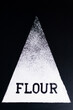 White triangle on a dark background. At the bottom of the figure is an inscription-flour.