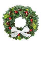 Wall Mural - Natural winter greenery wreath for Christmas with spruce fir, holly, acorns, pine cones, & mistletoe on white, background with bow. Traditional symbol for the festive season & New Year. Copy space.