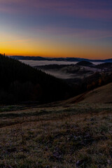 Wall Mural - sunrise view from the mountains of Romania autumn with fog