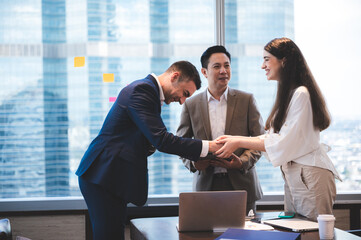 successful negotiate and handshake concept, two businessman shake hand with partner to celebration partnership and teamwork, business deal