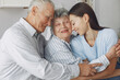 © prostooleh - Couple in a room. Grandparents sitting at home.