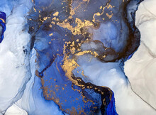 Abstract Blue Background With Beautiful Smudges And Stains Made With Alcohol Ink And Gold Pigment. Fragment Of Art With Blue Texture Resembles Watercolor Or Aquarelle Painting.