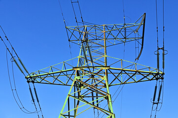 Electric lines pylon on blue sky background