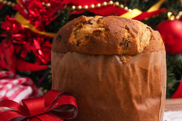 christmas panettone with red bow and ornaments