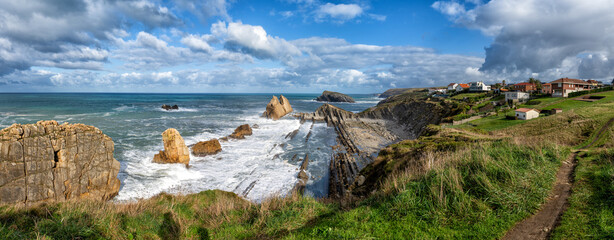 Sticker - panorama of a rocky and wild coast with stormy waves hitting the shore