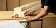 © Christian Vorhofer/Westend61 - Worker marking wood with pencil, tape measure