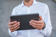 © Daniel Ingold/Westend61 - Close-up of businessman holding tablet