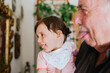 © Gemma Ferrando/Westend61 - Grandfather and granddaughter having fun together