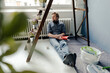 © Joseffson/Westend61 - Man renovating room sitting on the floor having a rest