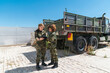 © Mikel Taboada/Westend61 - Female army soldiers discussing over digital tablet at military base on sunny day