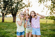 © Sofie Delauw/Westend61 - Portrait of playful girls pulling funny faces outdoors