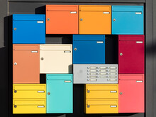 Apartment Intercom Surrounded By Colorful Mailboxes