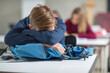 © zerocreatives/Westend61 - Teenage boy sleeping in class