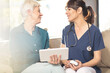 © Zero Creatives GmbH/Westend61 - Nurse talking to senior woman with tablet at home