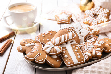 Wall Mural - Tasty decorated Christmas cookies on white wooden table. Bokeh effect