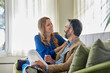 © ALTO IMAGES/Stocksy - Couple sitting on the sofa