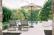 © Ali Harper Photography/Stocksy - Lounge chairs by a pool