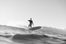 Black And White Photo Of Surfer On Wave In The Ocean