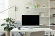 © Nicole Mason/Stocksy - minimal home office with imac in bright organized studio