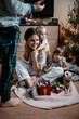 © irina polonina/Stocksy - Big family decorate the room for Christmas.