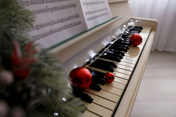 Wall Mural - White grand piano with festive decor indoors, closeup. Christmas music